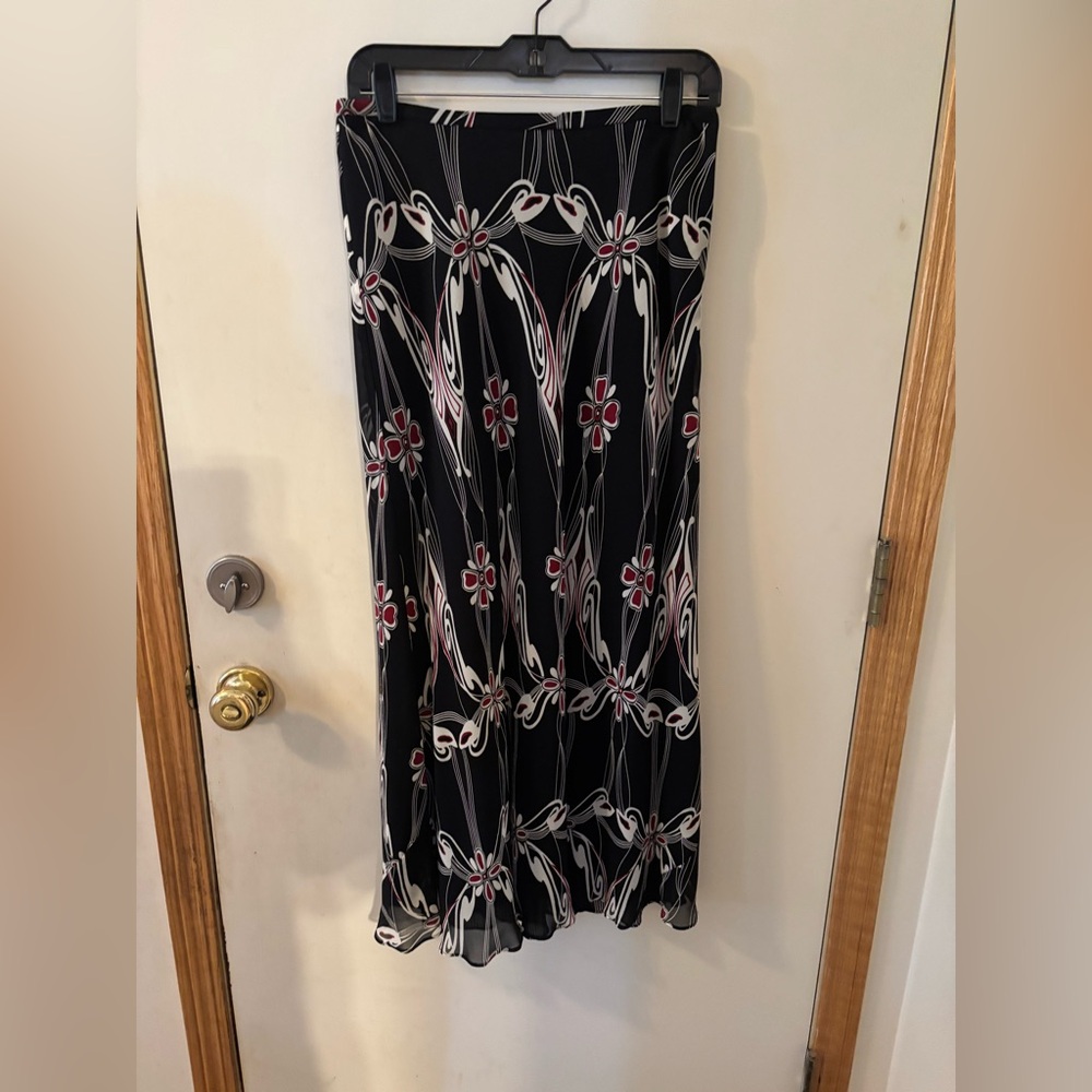 Size 8 silk skirt. Jones of New York. Black with abstract floral.